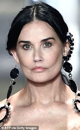 Demi Moore's face appears back to normal in new Fendi show .